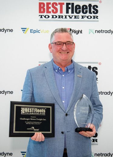 Steve Newton, Challenger Motor Freight director of safety and driver development, accepts the Best Fleets to Drive For award on behalf of the company. - Photo: CarriersEdge